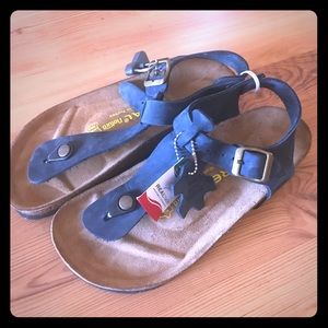 Leather insole/ never worn sandals.